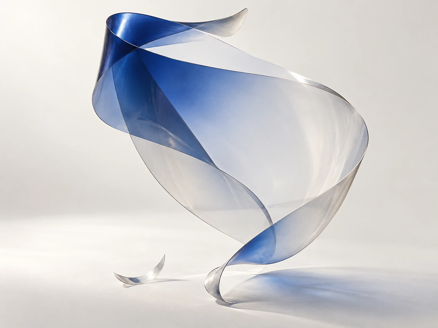 A translucent blue film shaped into a light sculptural curve.